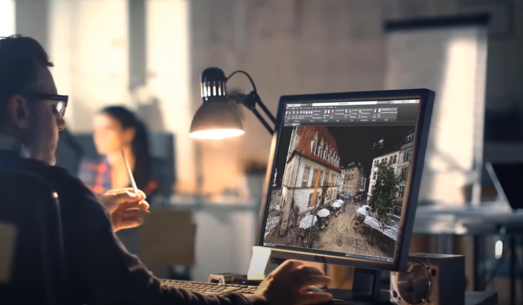 A guy creating a 3D scenic view on his computer